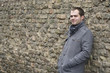 Young Man In Gray Coat Smiling Young Man In Gray Coat Smiling