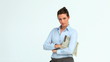 Woman reads a newspaper and crosses her arms