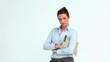 Businesswoman with a newspaper crossing her arms