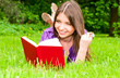 young woman reading on the ground