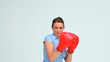 Businesswoman boxing in front of the camera