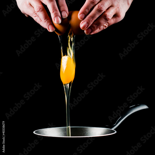 Photo: Yolk dropping in pan Yolk dropping in pan