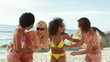 Video: Four girls in bikinis smiling together Four girls in bikinis smiling together