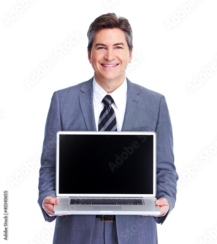 Foto: Executive businessman with laptop. Executive businessman with laptop.