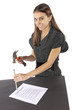 Foto: Metaphor businesswoman nails contract agreement Metaphor businesswoman nails contract agreement