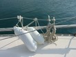 A sailing boat with white fenders A sailing boat with white fenders