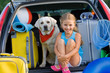 Travel, lovely girl with dog ready for family travel