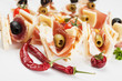 Canape with prosciutto and olives Canape with prosciutto and olives