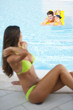 Young couple relaxing at swimming-pool