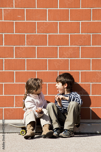 Photo: two children squabbling two children squabbling