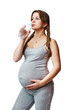 Pregnant woman drinking a bottle of water