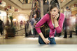 Young woman in shopping center