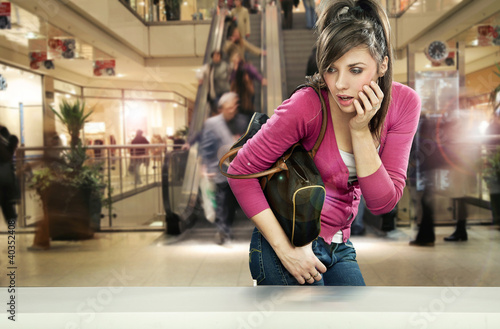 Photo: Young woman in shopping center Young woman in shopping center