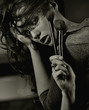 Portrait of a woman with brushes