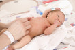 Mother caressing baby at hospital