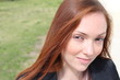 Pretty young woman smiling to camera