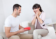 Man giving a present to woman