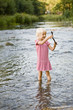 Girl playing in stream