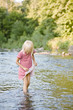 Girl playing in stream
