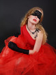 Foto: woman with covered eyes in red dress woman with covered eyes in red dress