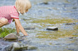 Girl playing in stream