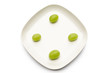 Green grapes on plate, directly above