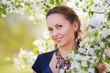 Beautiful woman in a spring garden