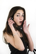 Photo: Upset teenage girl talking on the phone Upset teenage girl talking on the phone