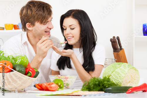 Photo: young couple in kitchen young couple in kitchen