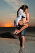 the guy holding the girlfriend