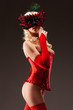 Sexy corseted woman in mask, ower grey