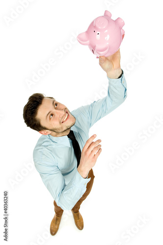 Photo: Man with piggy bank Man with piggy bank