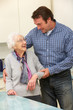 Mother and adult son in kitchen