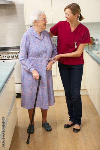 Photo: Senior woman and carer in kitchen Senior woman and carer in kitchen