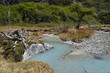 Fresh water flowing from a deep blue river