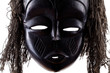 Photo: Black tribal face mask on white background Black tribal face mask on white background