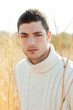 Autumn winter man portrait in outdoor dried grass Autumn winter man portrait in outdoor dried grass