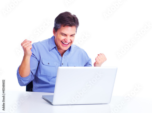 Photo: Happy man with laptop computer. Happy man with laptop computer.