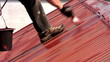 Painting roof of a private house, close-up