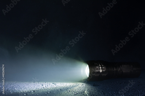 Photo: Tactical waterproof flashlight with waterdrops and smoke Tactical waterproof flashlight with waterdrops and smoke