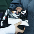 Customer gets service book from master mechanic