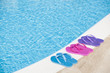 Colorful slippers by pool