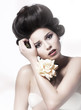 Beauty. Serene young pretty woman with flower