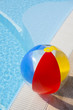 Beach ball on swimming-pool
