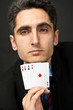 Young lucky gambler with cards Young lucky gambler with cards