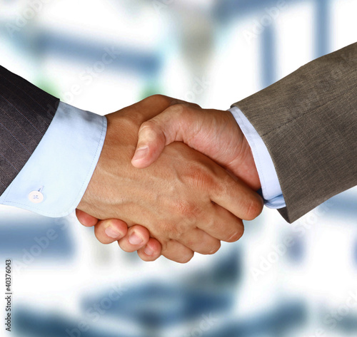 Photo: Two businessman shaking hands Two businessman shaking hands