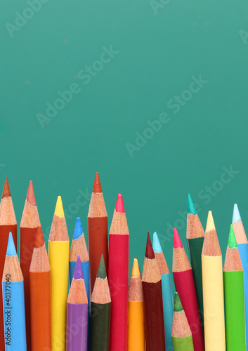 Photo: Group of pencils, blackboard behind Group of pencils, blackboard behind