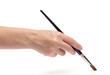 Woman hand paiting over white background