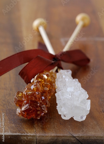 Photo: crystal sugar candy on a wooden stick crystal sugar candy on a wooden stick