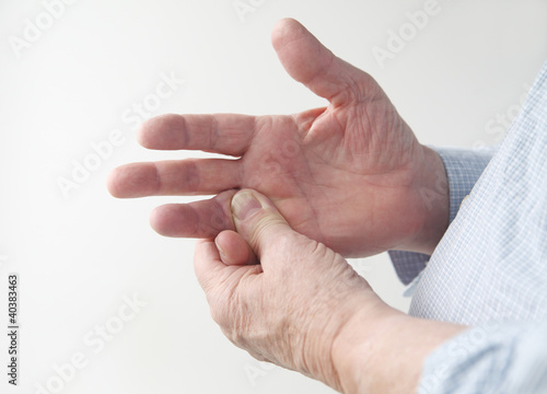 Photo: man with sore finger man with sore finger
